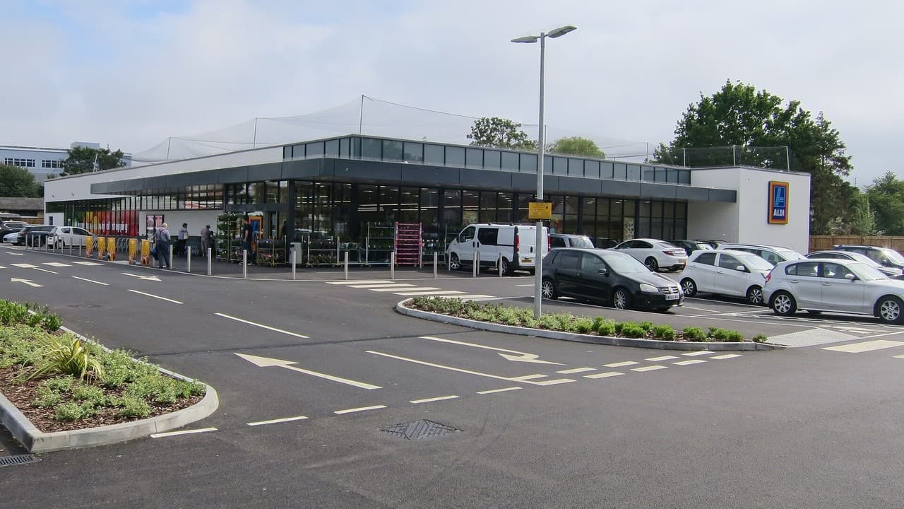 An Aldi supermarket in Eastbourne with its car park and shopping trolleys outside the entrance