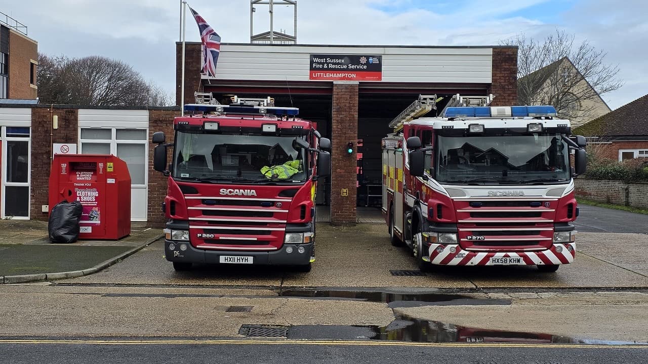 Two West Sussex Fire and Rescue Service fire engines parked outside their fire station in Littlehampton