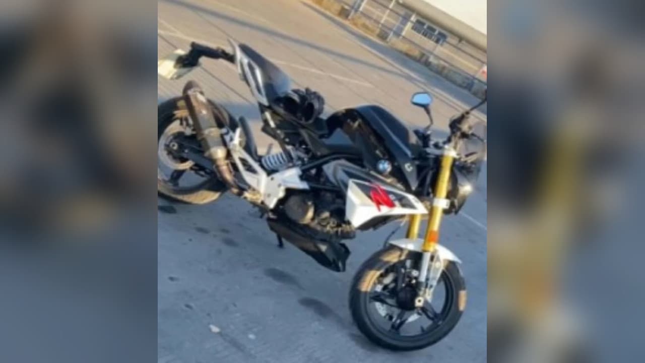 Stolen BMW motorcycle with a black, silver and white body and gold front fork, released by Sussex Police after a man was hit in Burgess Hill