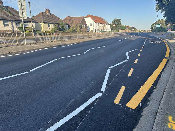 A newly resurfaced road in Brighton and Hove with fresh white lines and yellow parking restrictions