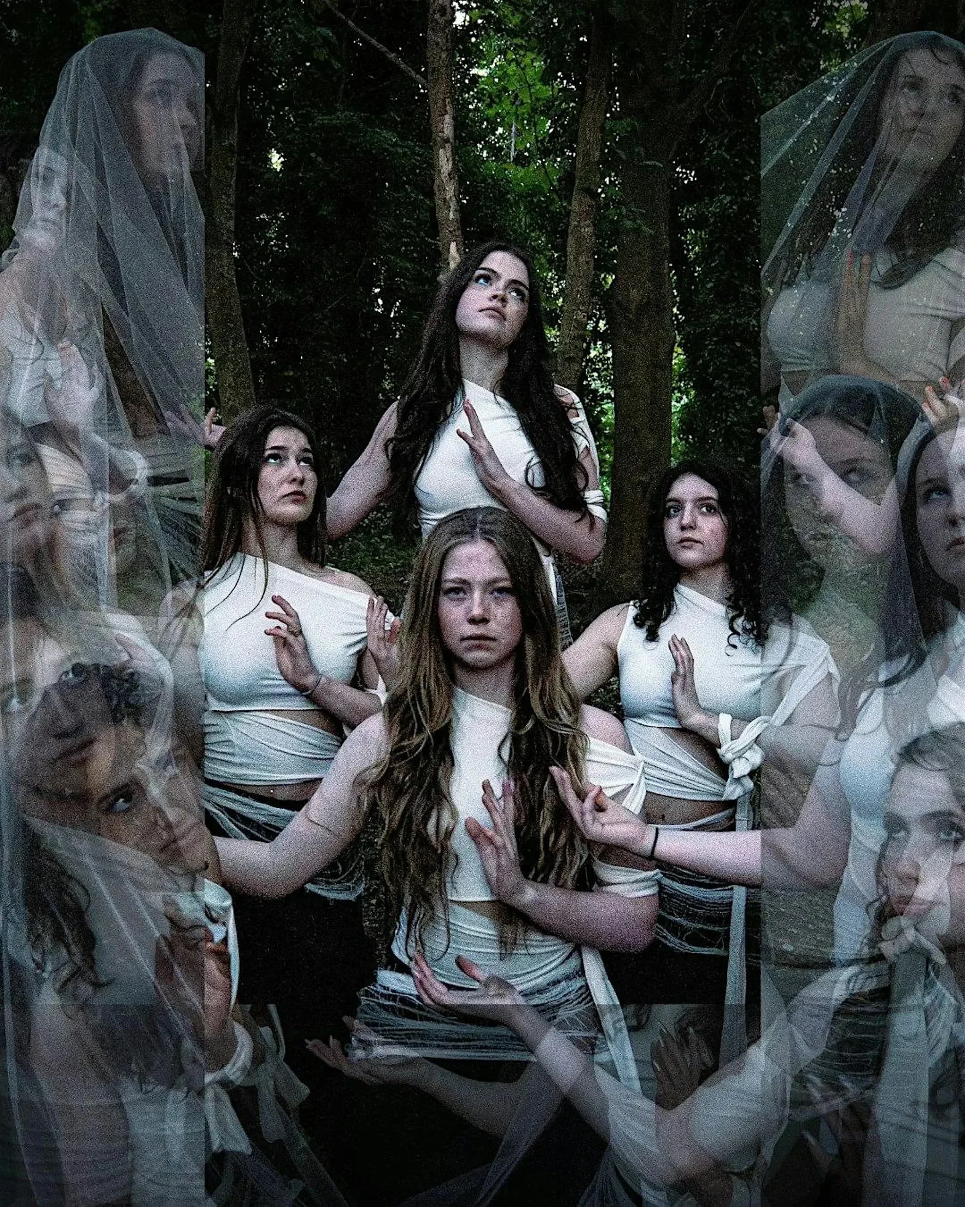 Dancers from Entasi Dance Company in white costumes in a woodland setting, promotional image for How to Hold an Ice Cube at Roedean Theatre
