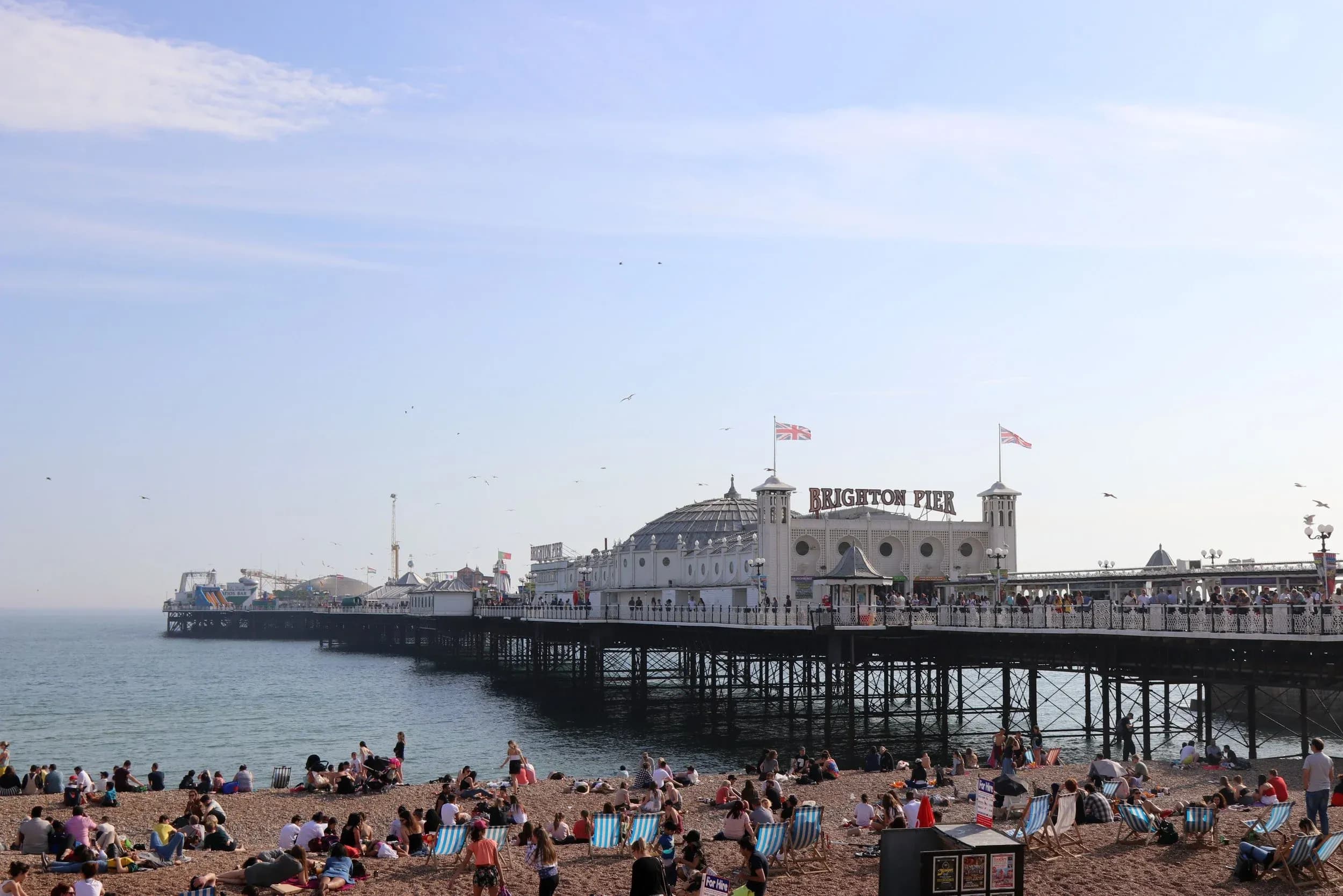 Brighton beach crowds near the pier on a sunny day